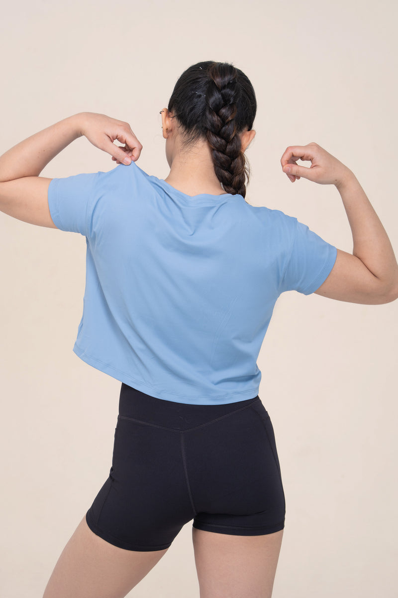 Red Husky Cropped Training Tee — Moon White Blue — lifestyle — studio