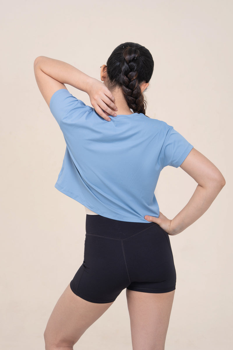 Red Husky Cropped Training Tee — Moon White Blue — back — studio