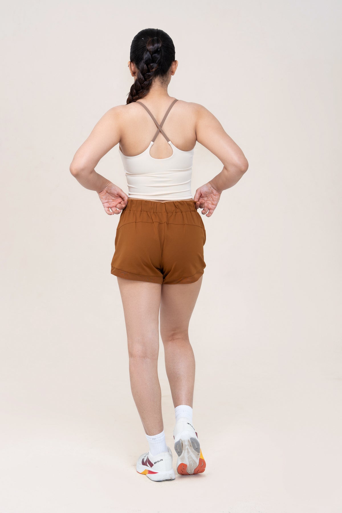 Red Husky Training Shorts — Amber Brown — back — studio
