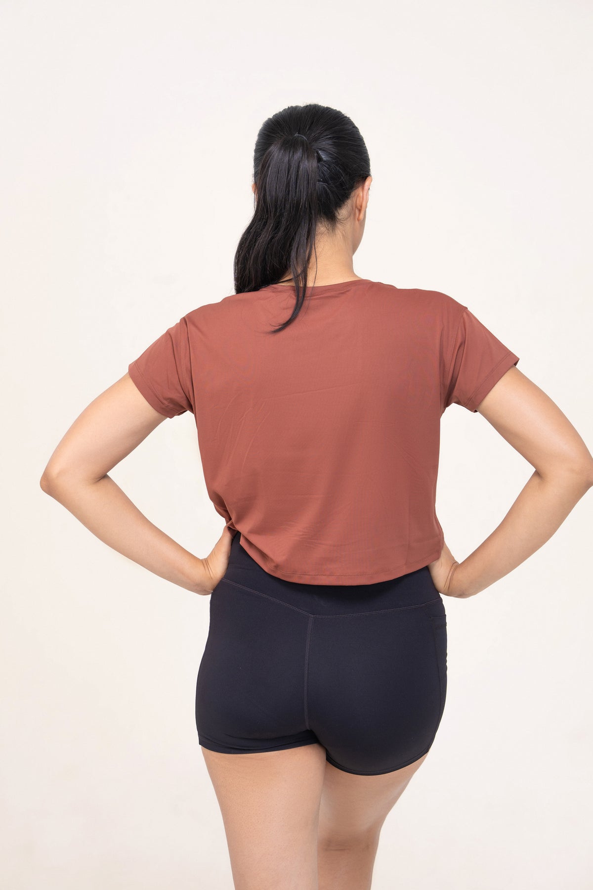 Red Husky Cropped Training Tee — Bronze Brown — back — studio